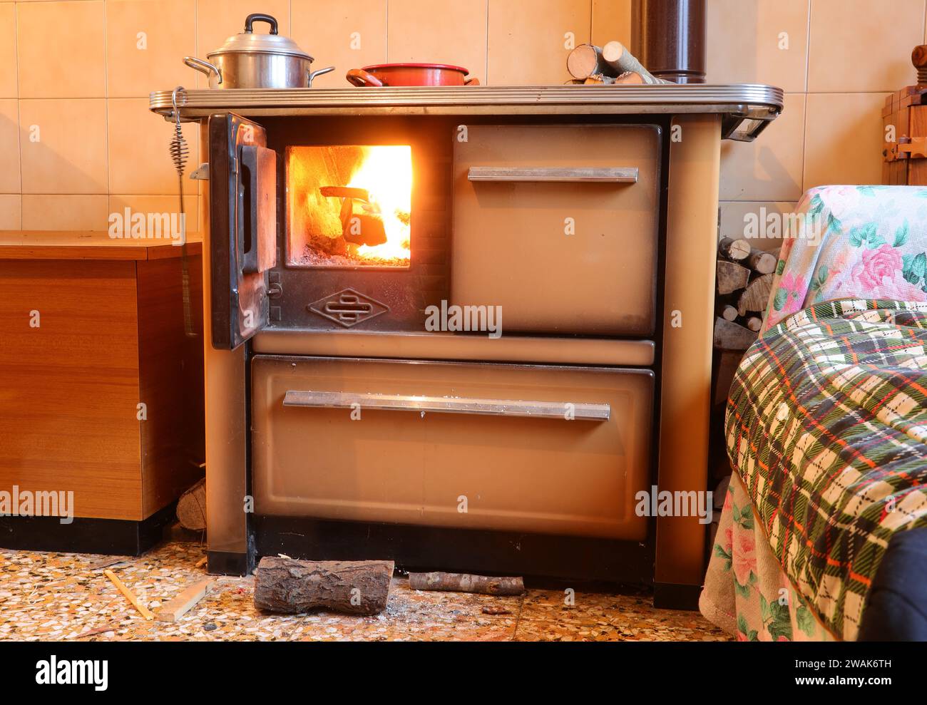 wood stove of the economical kitchen inside a mountain house without
