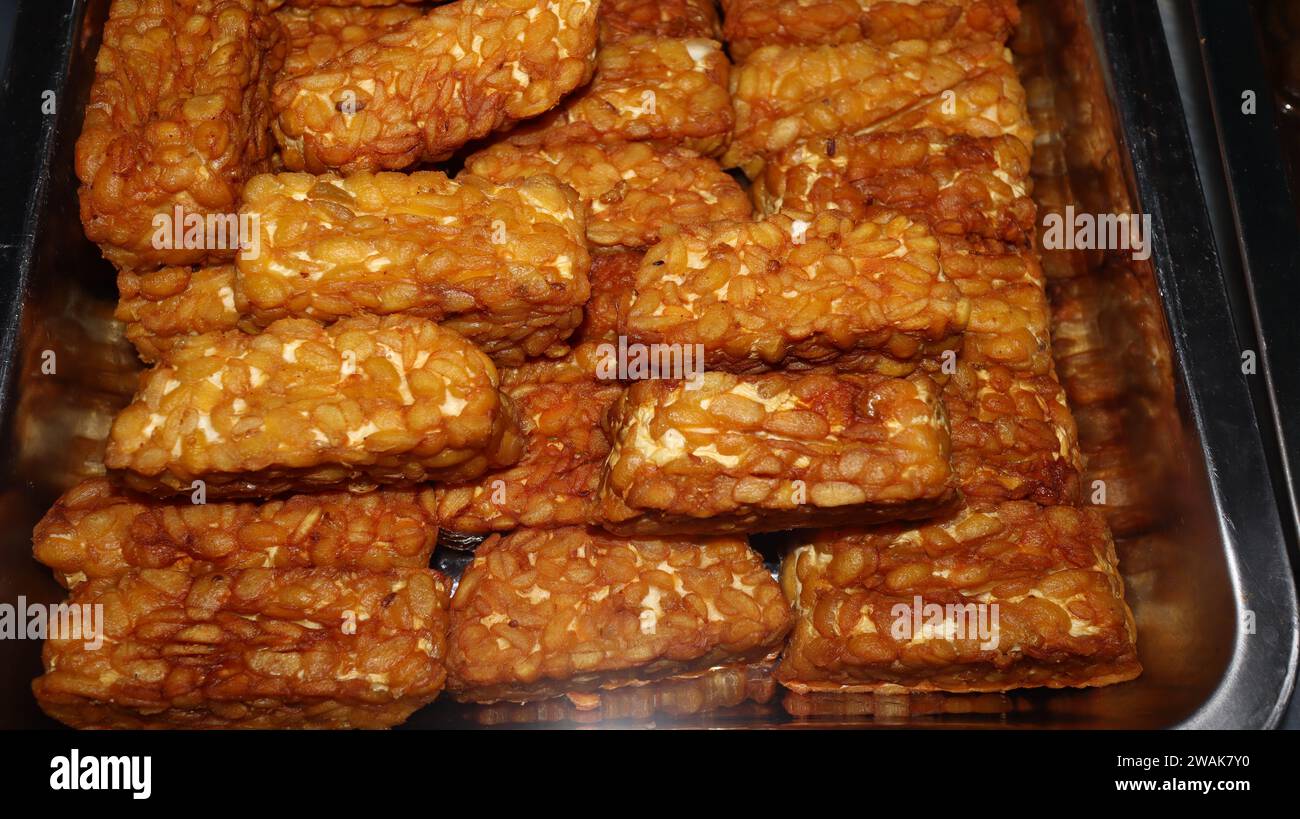 Pile of tempe goreng or Fried tempe typical Indonesian food Stock Photo