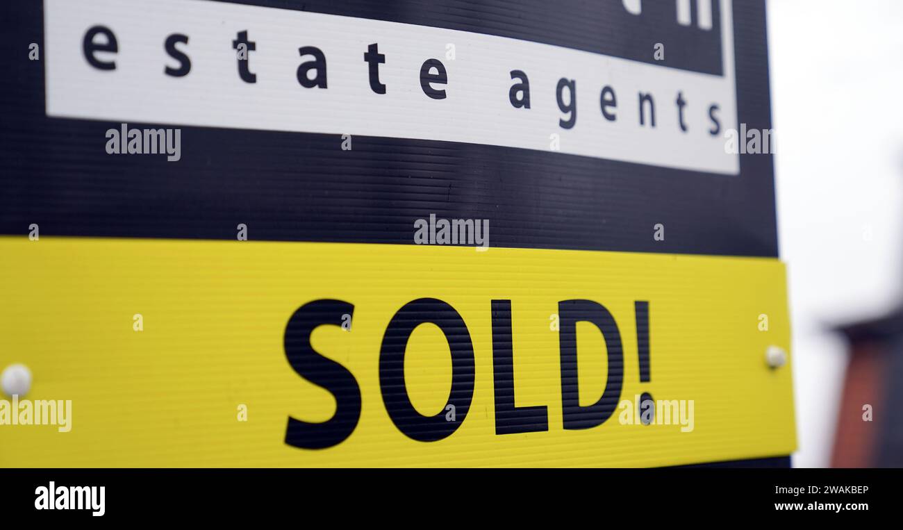 File photo dated 10/1/2022 of a sold board outside a property in Staines-upon-Thames in Surrey. The housing market 'beat expectations' in 2023, with the average UK property value ending the year £4,800 higher than it had been at the end of 2022, according to an index. Property values increased by 1.7% on average across 2023, Halifax said. Issue date: Friday January 5, 2024. Stock Photo