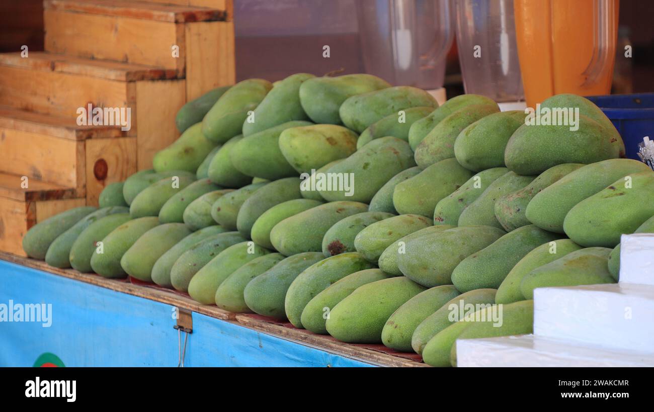 Pile of green mango, Anacardiaceae, Mangifera indica Linn. selling in the market Stock Photo Alamy