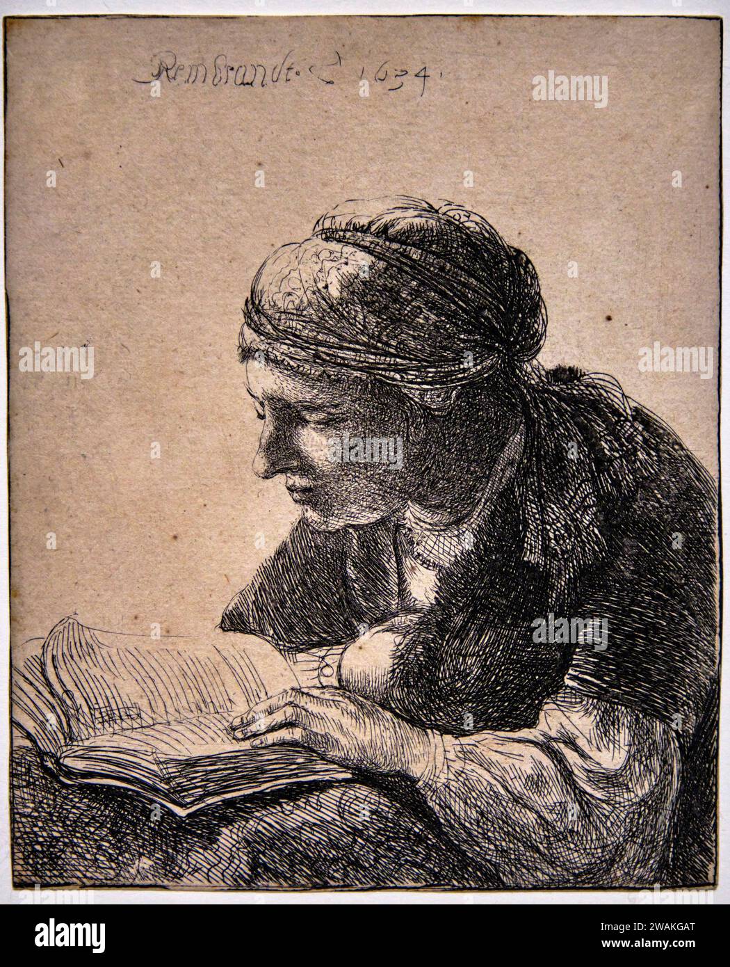 Rembrandt etching exhibition, The Reader, 1634 Stock Photo Alamy