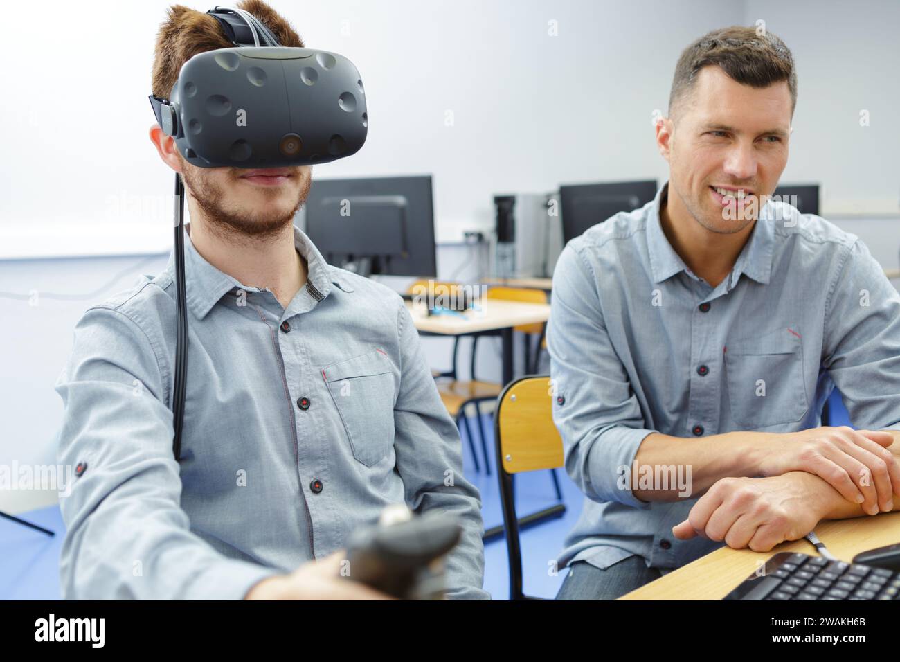 young man in technology lab using virtual reality headset Stock Photo