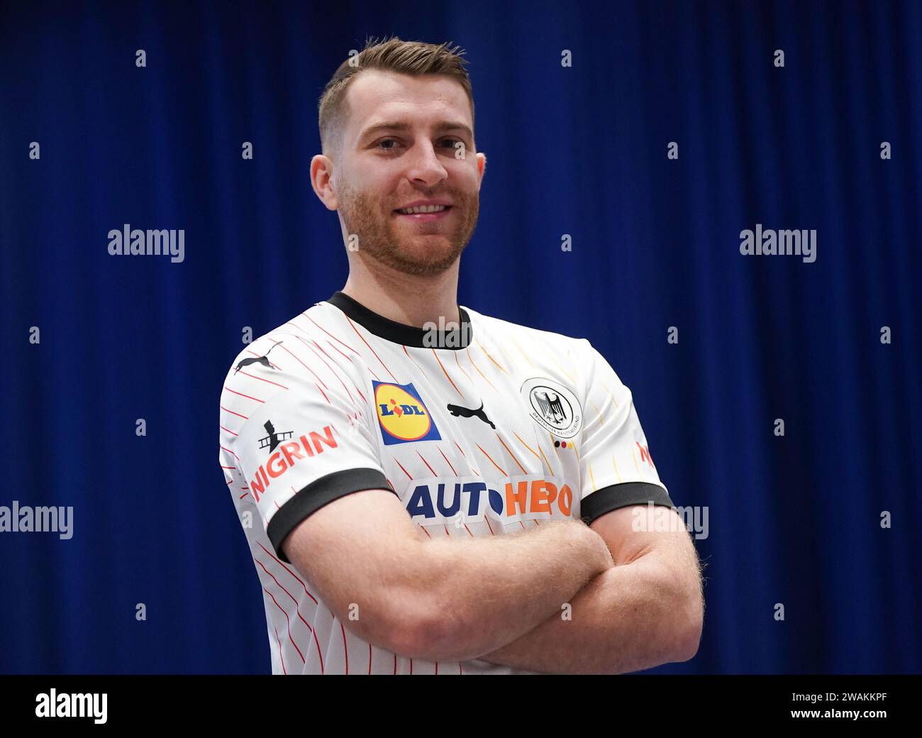 05 January 2024, Schleswig-Holstein, Brunsbüttel: Handball: European Championship, men, German Handball Federation (DHB) media event, team photo and individual photos, at the Elbeforum Brunsbüttel. National player Lukas Mertens. Photo: Marcus Brandt/dpa Stock Photo