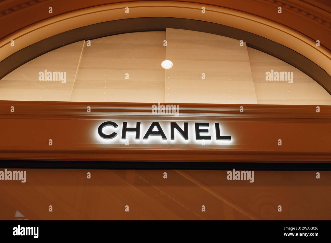 Chanel logotype. Classy luxury boutique showcase. Chanel is a fashion house founded in 1909 specialized in haute couture goods. Stock Photo