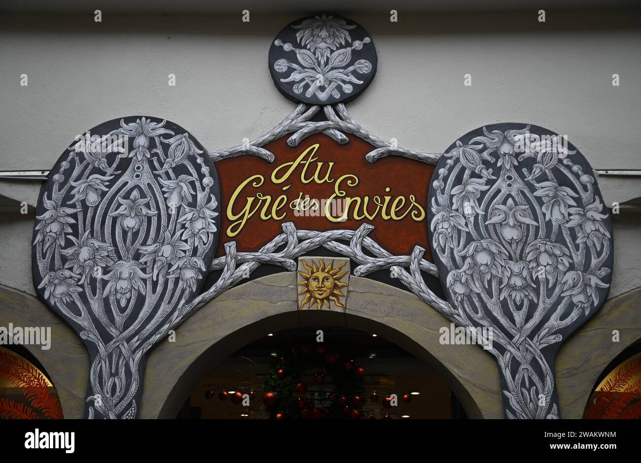 Scenic arched entrance with a hand painted sign written in French of ...
