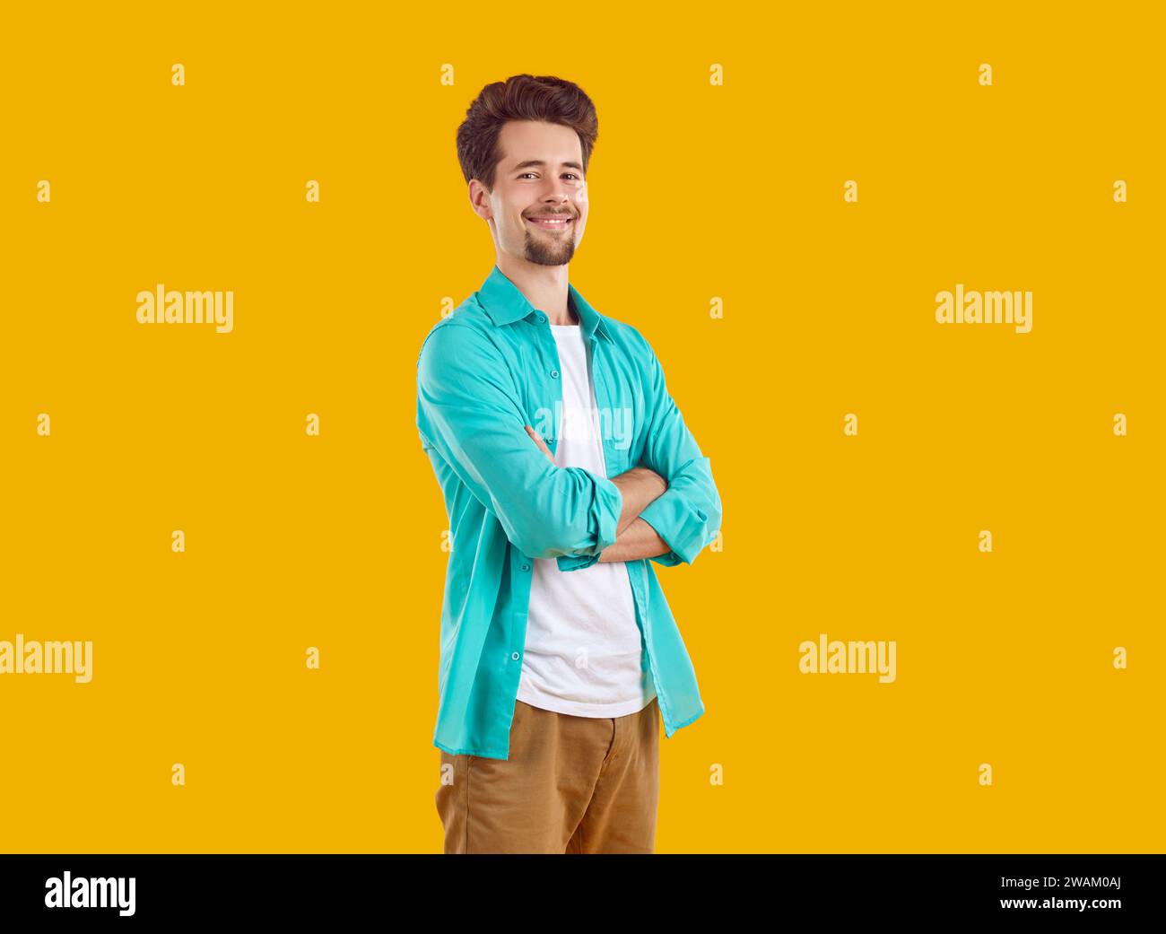 Happy positive young man standing hi-res stock photography and images ...