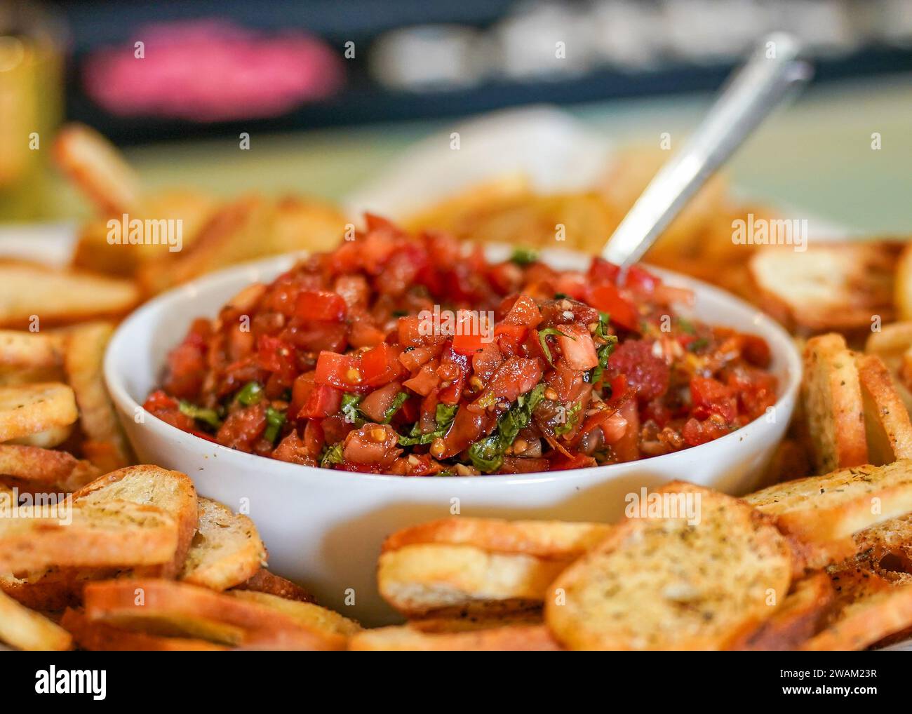 Bowl of tomato bruschetta with toasted bread Stock Photo