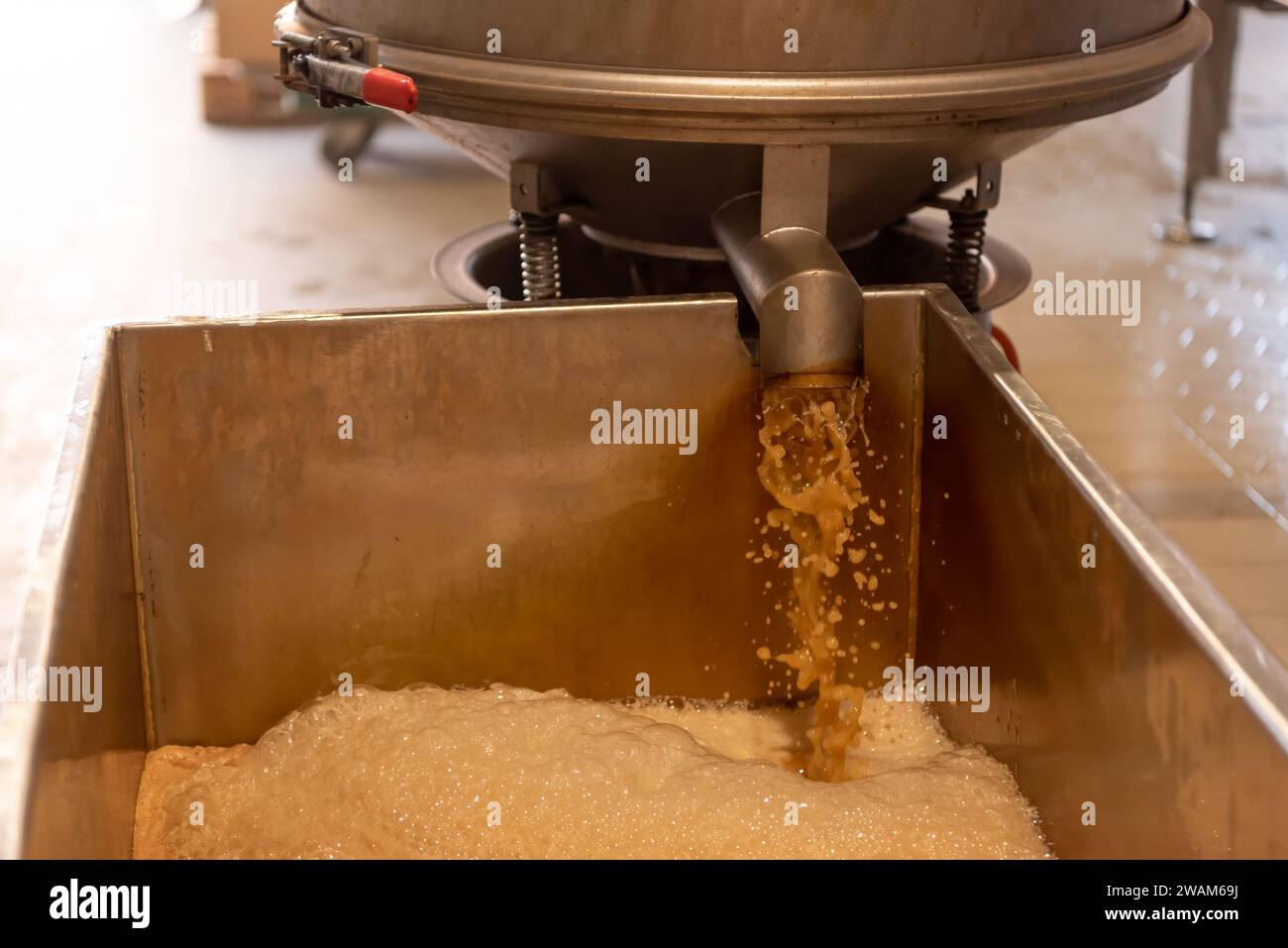Vibrating sieve used in the apple juice production process Stock Photo