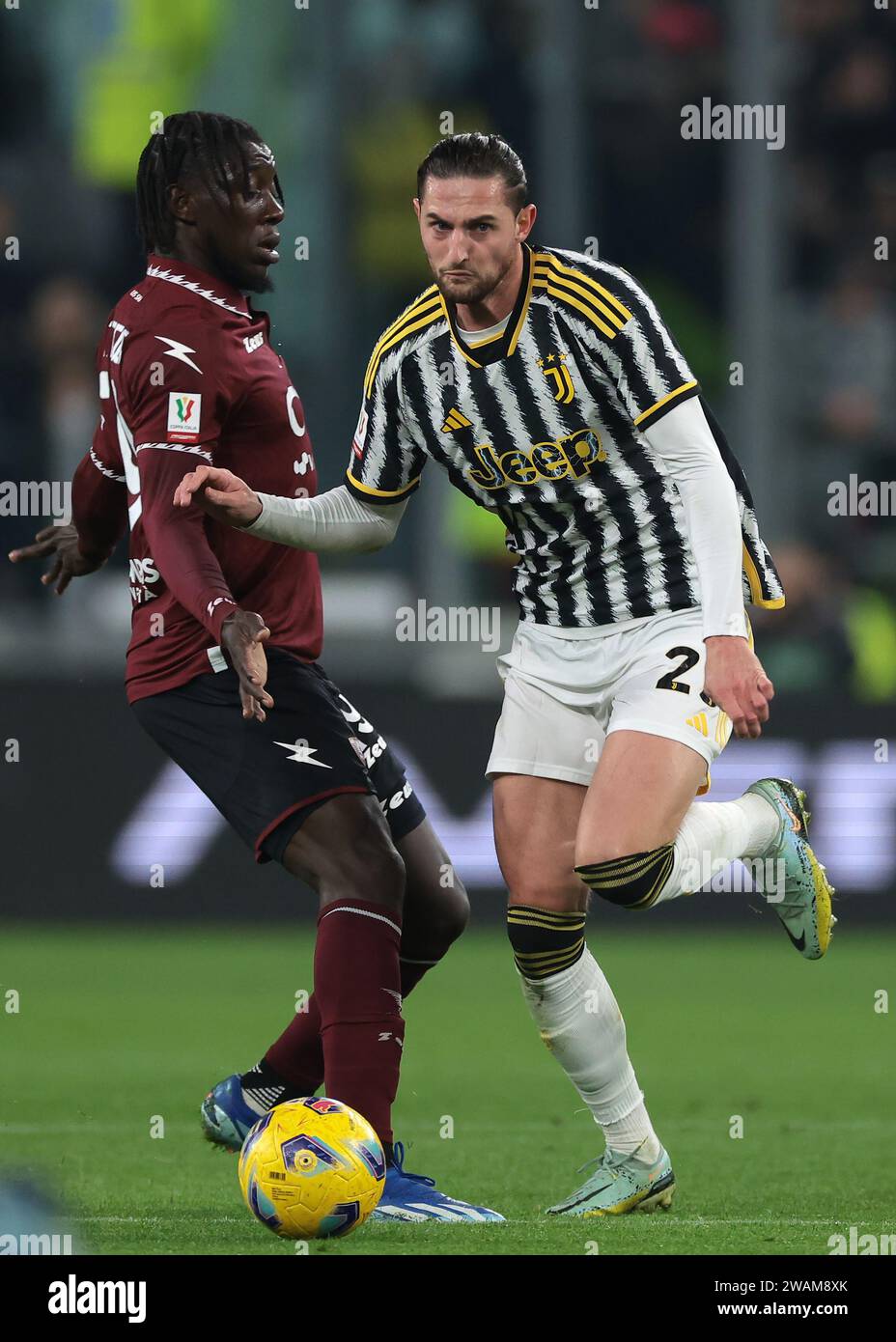 Turin, Italy. 4th Jan, 2024. Adrien Rabiot of Juventus takes on Vincent ...