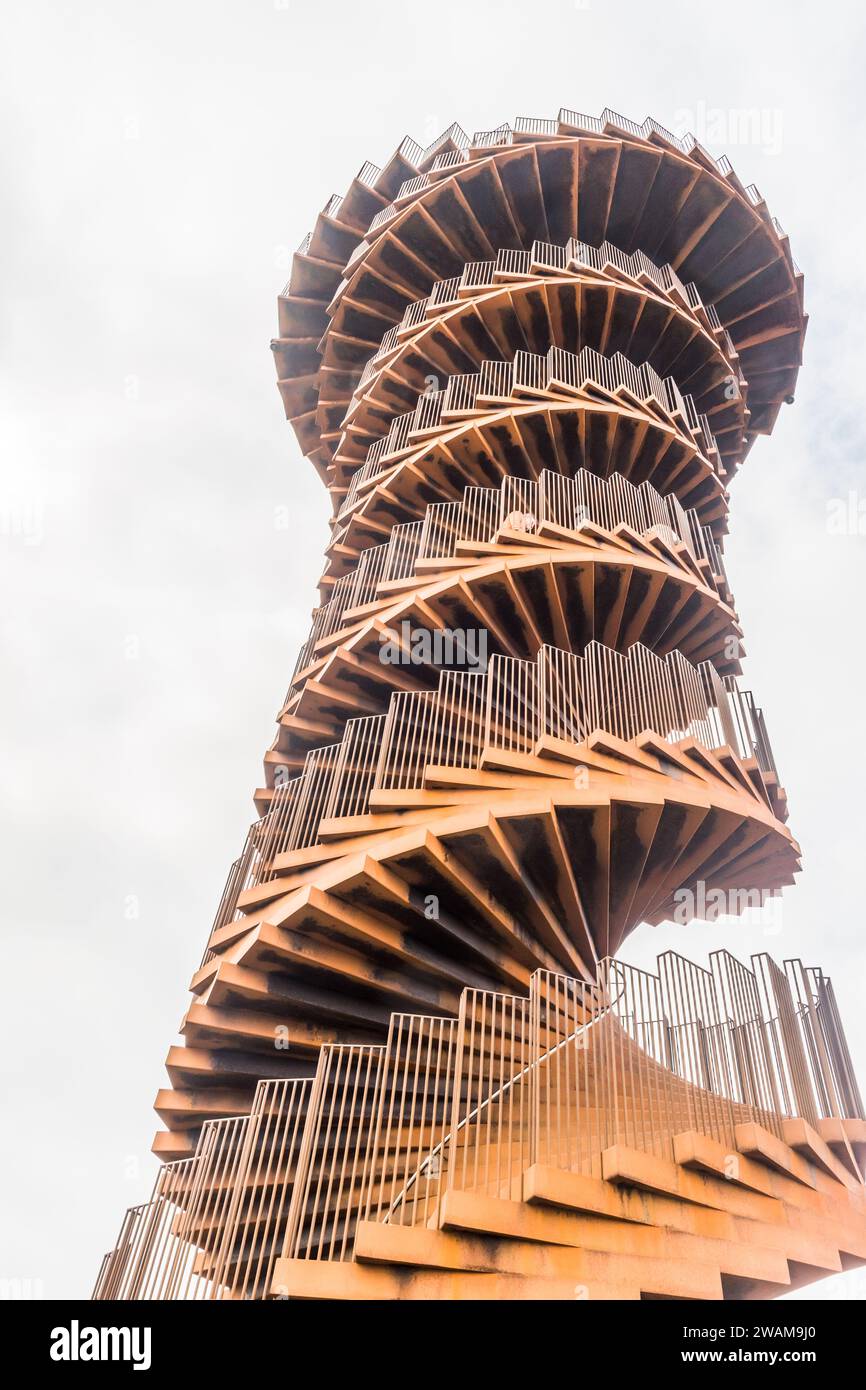 Skaerbaek, Denmark - June 4, 2023: Marsk or Marsh Tower is a double helix-shaped corten steel observation tower located in the Wadden Sea National Par Stock Photo