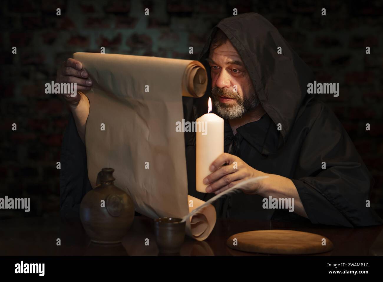 Monk in black robe hi-res stock photography and images - Alamy