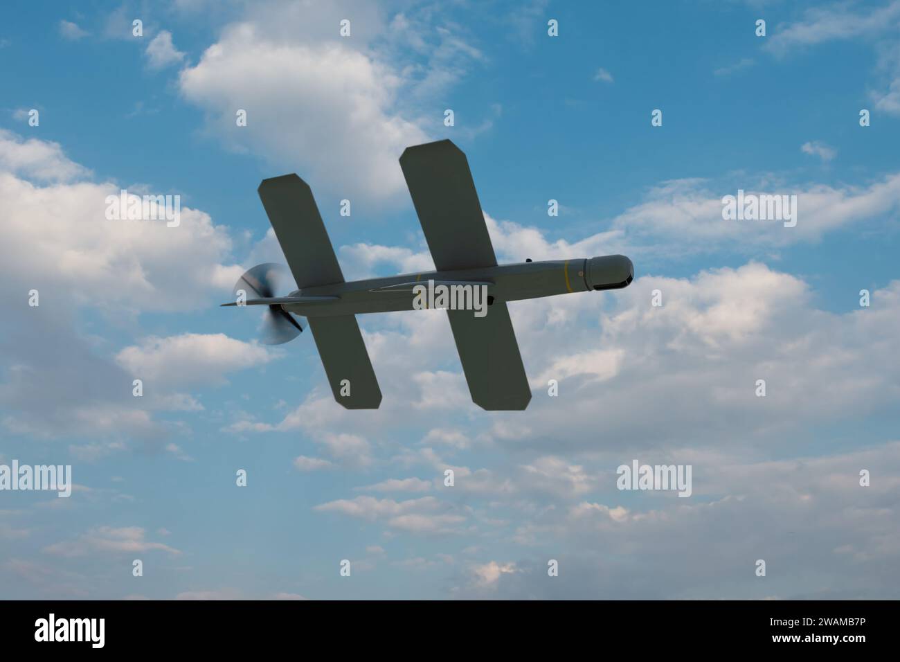 Lancet kamikaze drone on the background of the sky under the clouds, Russian drone attacks. Concept: military strike reconnaissance quadcopter, Stock Photo