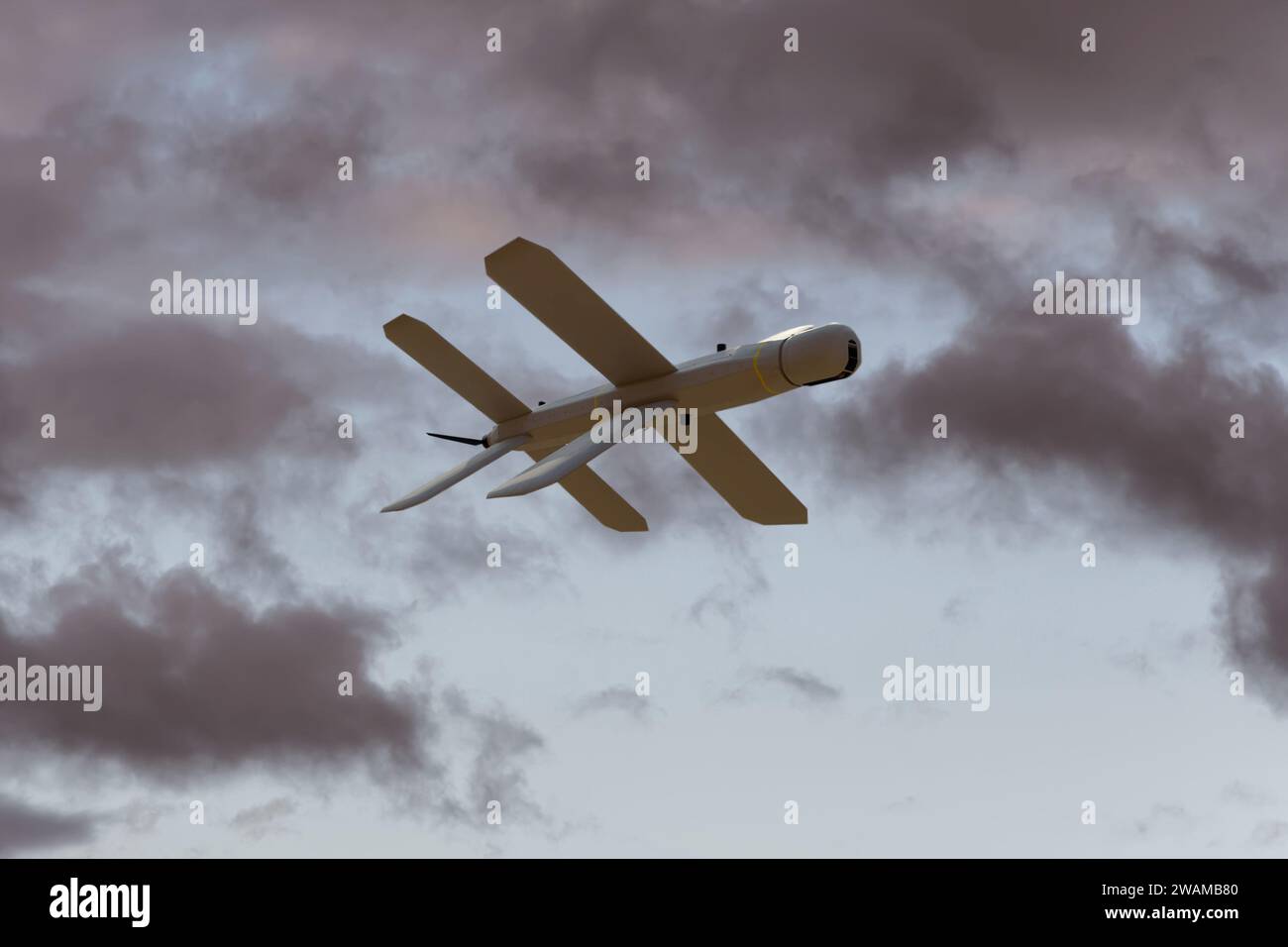 Lancet kamikaze drone on the background of the sky under the clouds, Russian drone attacks. Stock Photo