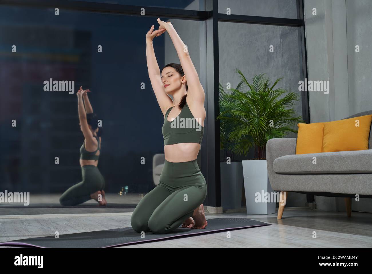 Woman yoga arms above head hi-res stock photography and images - Alamy