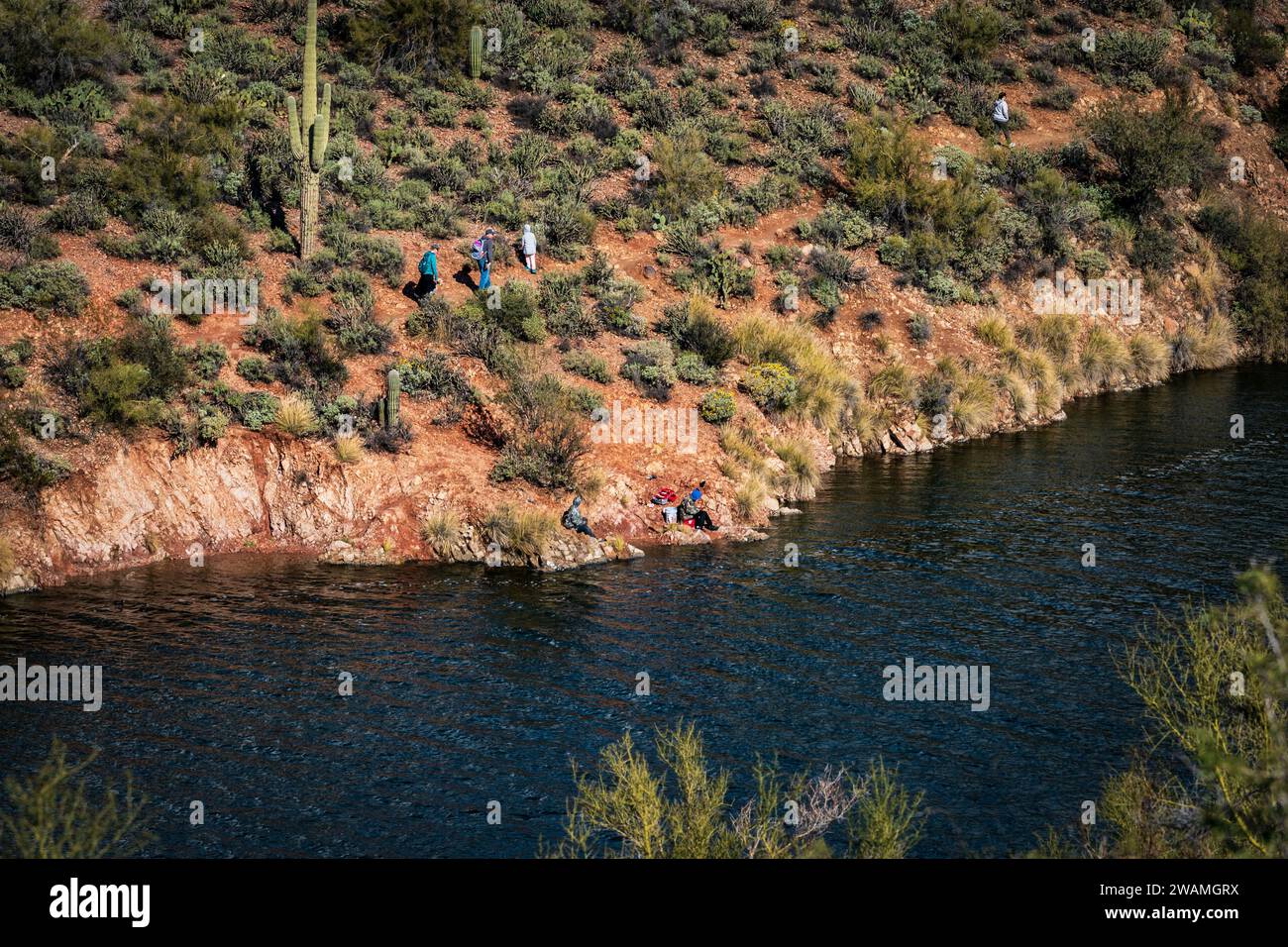 People fishing and hiking at the trail by Butcher Jones Recreational Area, Saguaro Lake, Arizona. Stock Photo