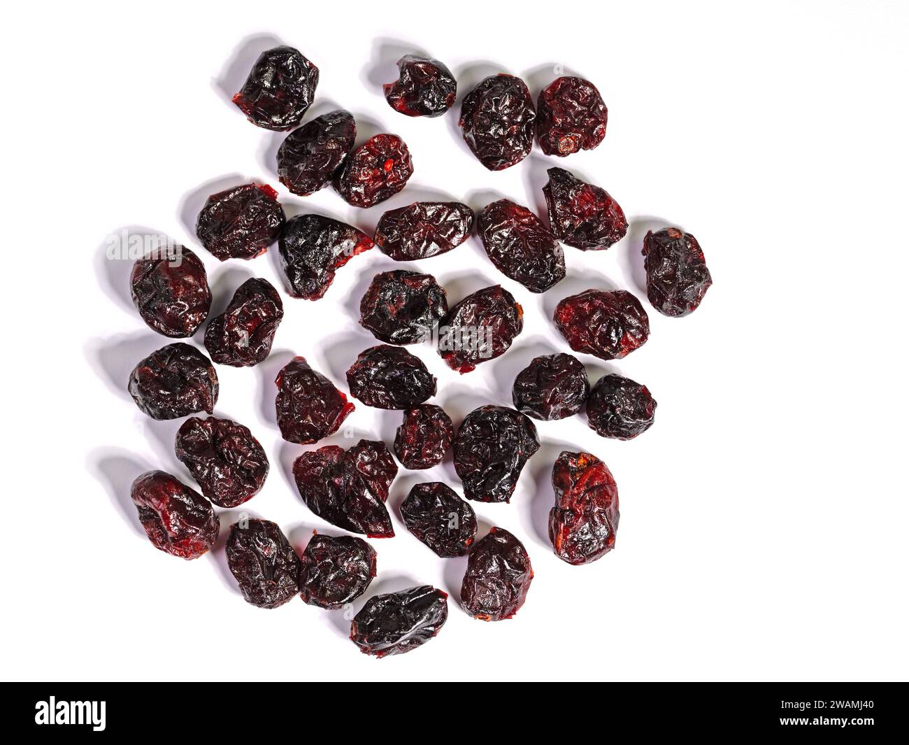 Dried cranberries against a white background Stock Photo