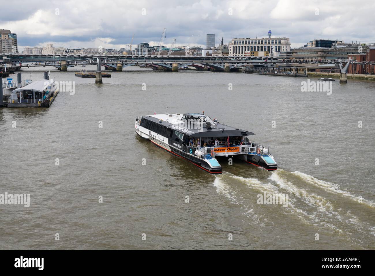 London, UK - March 18, 2023; Thames Clippers river boat Monsoon Clipper approaching Bankside seen from above Stock Photo