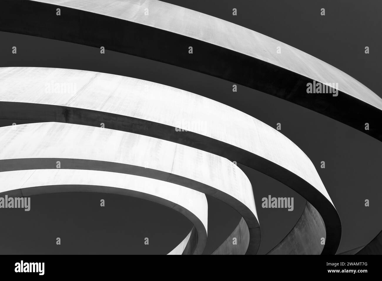 Striking monochrome architectural feature with sweeping curves and a