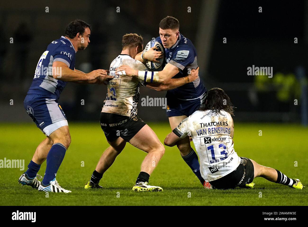 Sale sharks' sam james is tackled by bristol bears' james williams and johannes  janse van rensburg (right) during the gallagher premiership match at the aj  bell stadium, salford. picture date: friday january