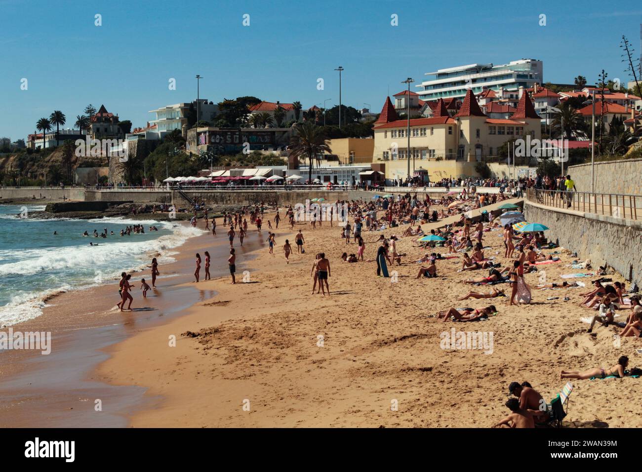 View of the Estoril seafront, the puddles beach and the yellow building of the Children's Colony for Popular Education, in Estoril, Portugal, Europe Stock Photo