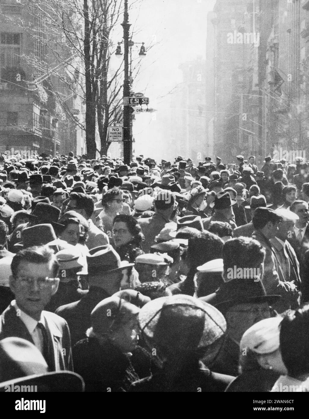 Large crowd street scene, East 51st Street, New York City, New York, USA, Angelo Rizzuto, Anthony Angel Collection, April 1956 Stock Photo