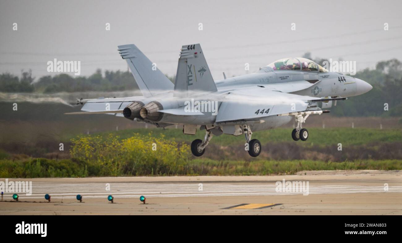 An EA-18G Growler from the U.S. Navy’s Air Test and Evaluation Squadron Nine (VX-9) leaves a trail of wingtip vortices as it lands amid humid conditions at Naval Base Ventura County (NBVC) Point Mugu in Southern California on Aug. 9, 2023, following a training mission over NBVC’s offshore Point Mugu Sea Range. The squadron is based at Naval Air Weapons Station China Lake in California, and is commonly referred to by its nickname, the Vampires. (U.S. Navy photo by Eric Parsons/Released) Stock Photo