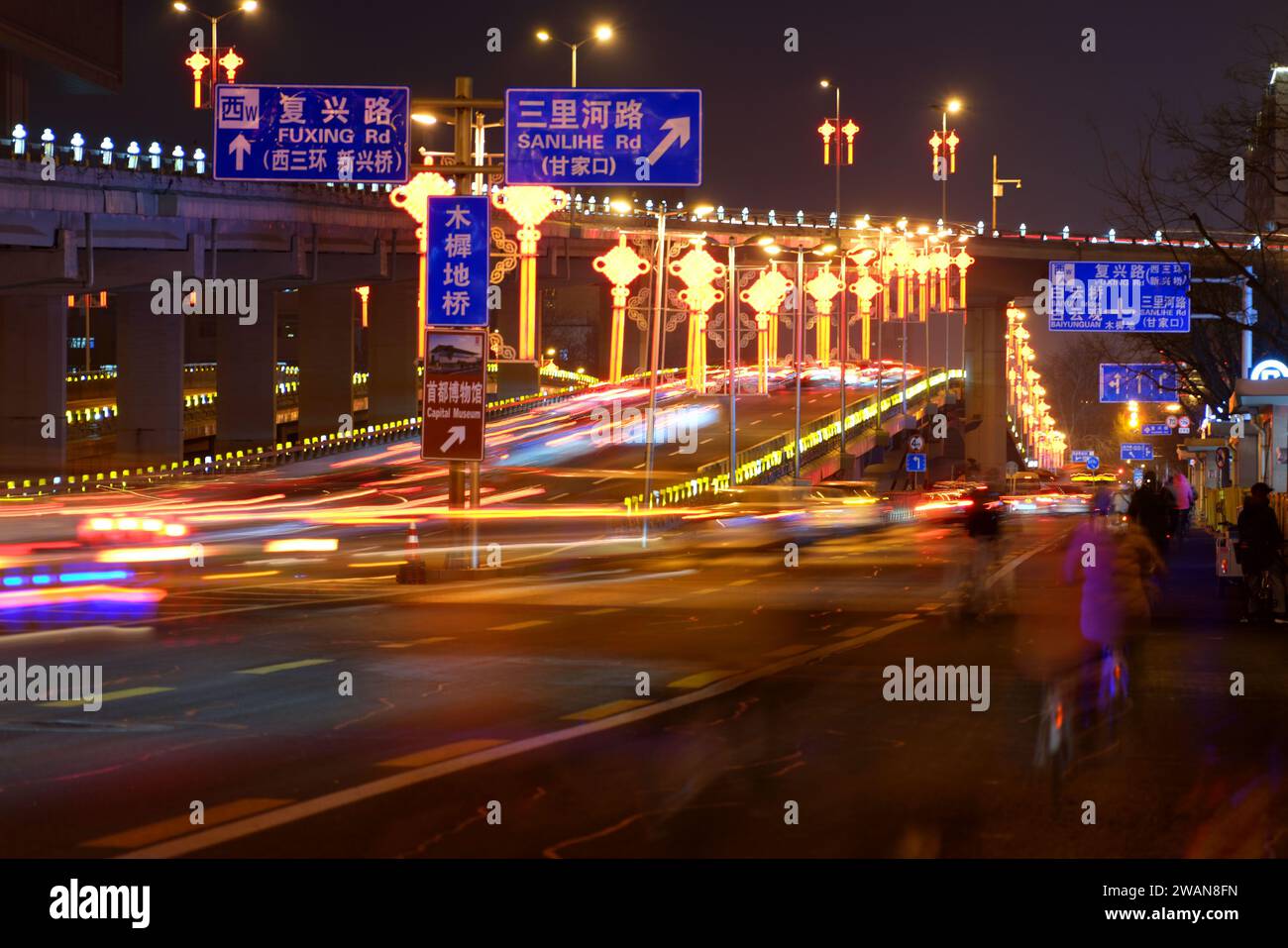 BEIJING, CHINA - JANUARY 5, 2024 - The brightly lit Muxidi overpass on ...