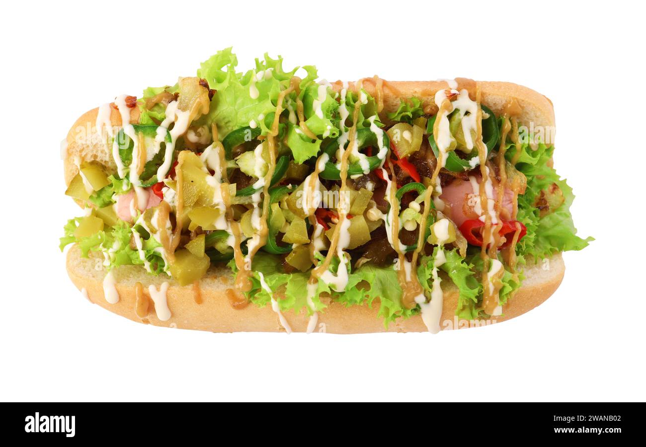 One tasty hot dog with chili, lettuce, pickles and sauces isolated on white, top view Stock Photo
