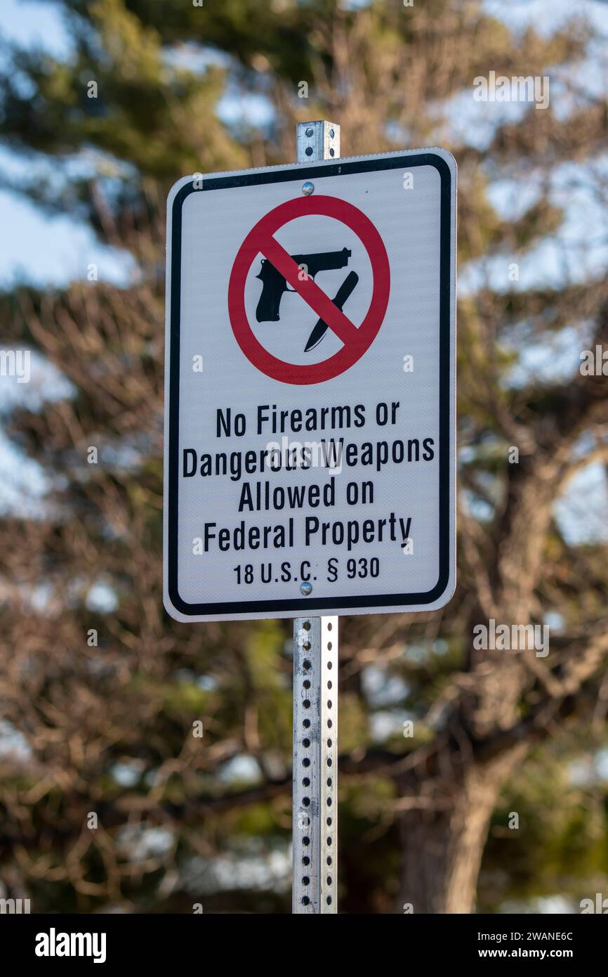 Lawrence, Kansas. Haskell Indian Nations University. No firearm on Federal property sign. Stock Photo