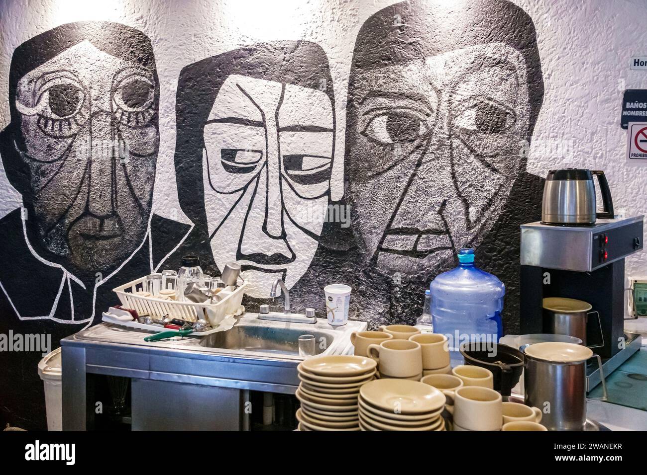 Merida Mexico,centro historico central historic district,mural kitchen stacked dishes sink,inside interior indoors,restaurant dine dining eating out,c Stock Photo