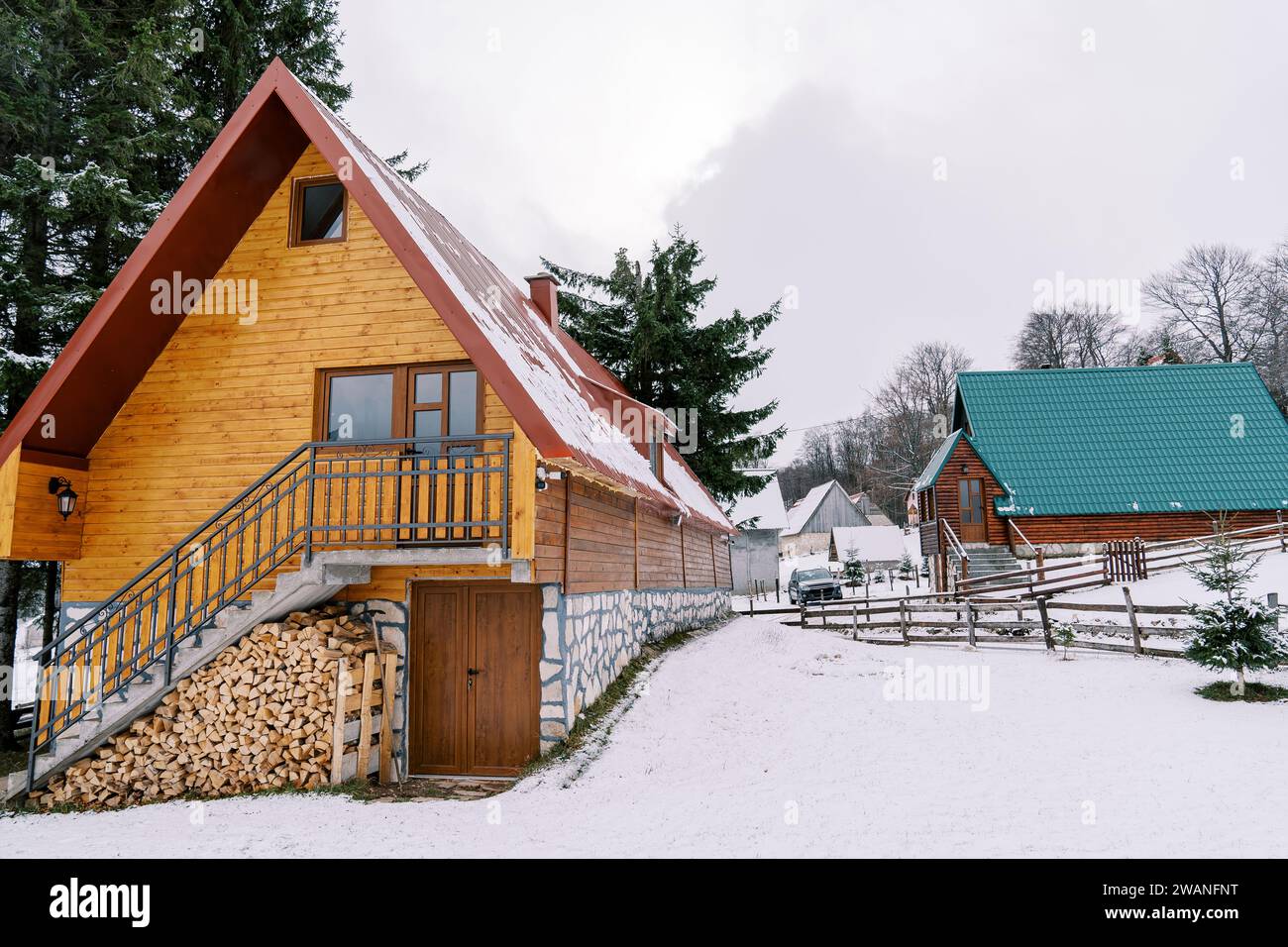 Wooden cottages in a small village in a snowy forest Stock Photo - Alamy