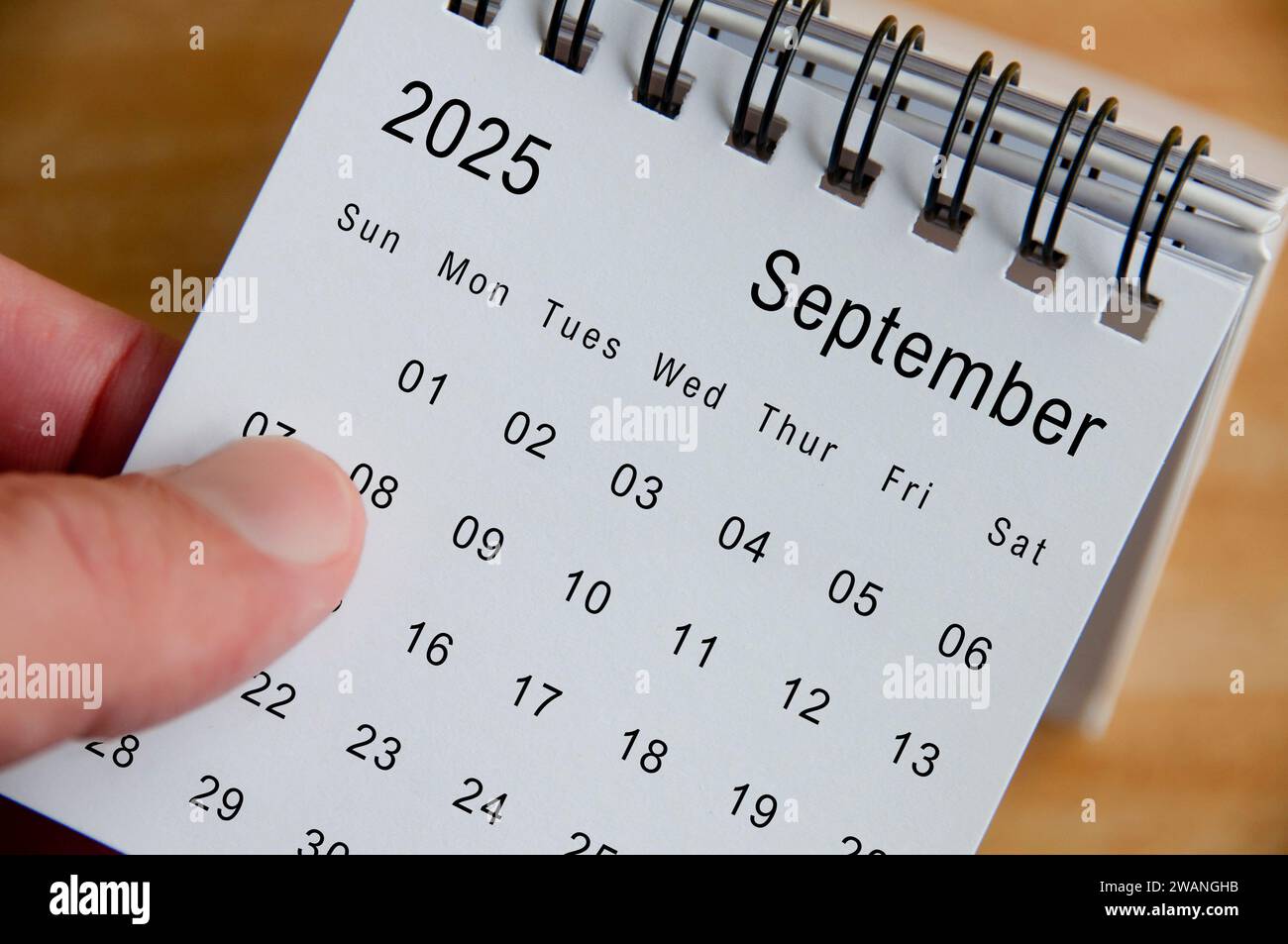 Close up view of September 2025 Calendar on wooden desk background