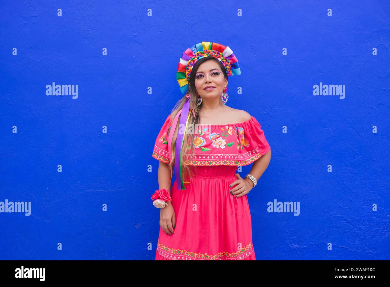 Mexican woman wearing embroidered dress and Lele doll headband. Outdoor portrait Stock Photo - Alamy Mexican woman wearing embroidered dress and Lele doll headband. Outdoor portrait Stock Photo - Alamy