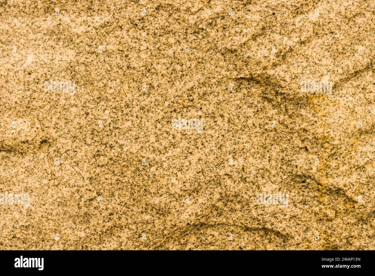 Yellow stone background. Toned stone texture. Embossed surface for design. Stock Photo