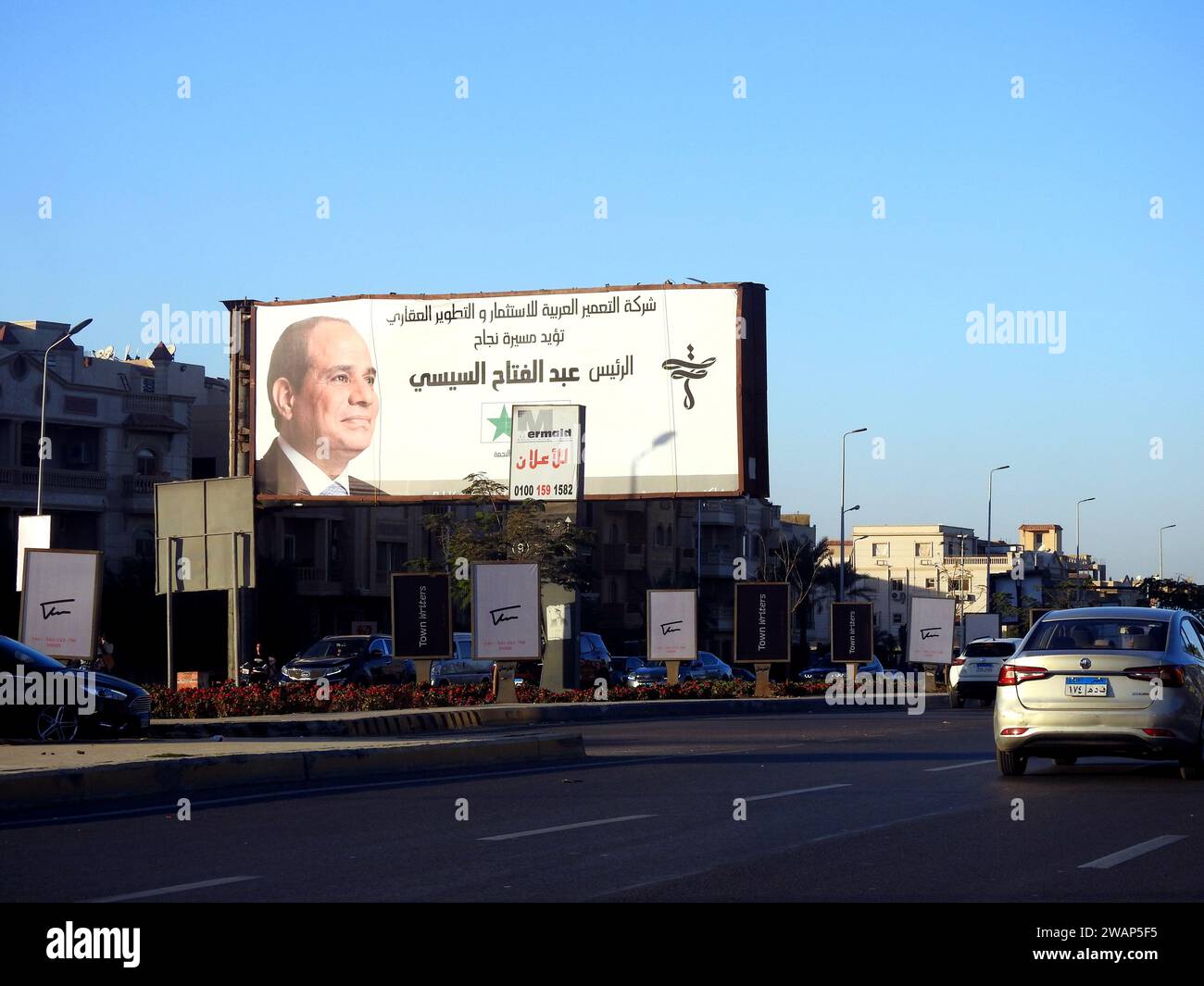 Cairo, Egypt, December 15 2023: Egyptian presidential election campaign banners, Egypt's president election 2024 advertisement near Cairo monorail sit Stock Photo
