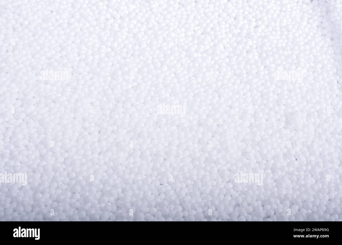 White little polystyrene foam balls as background Stock Photo