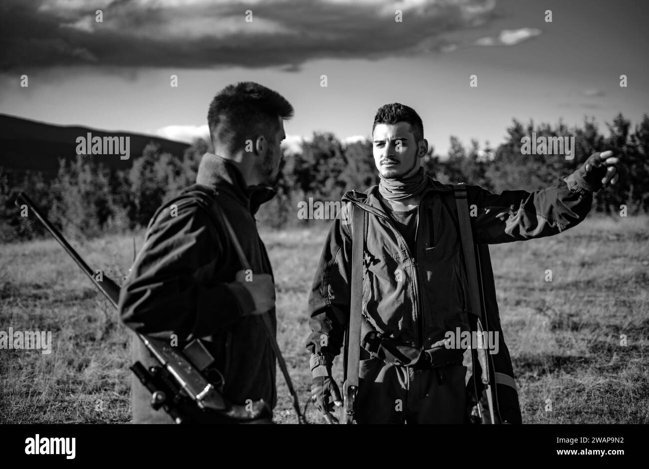 Two Hunters with shotgun gun on hunt. Group deer hunt. What Animals Can