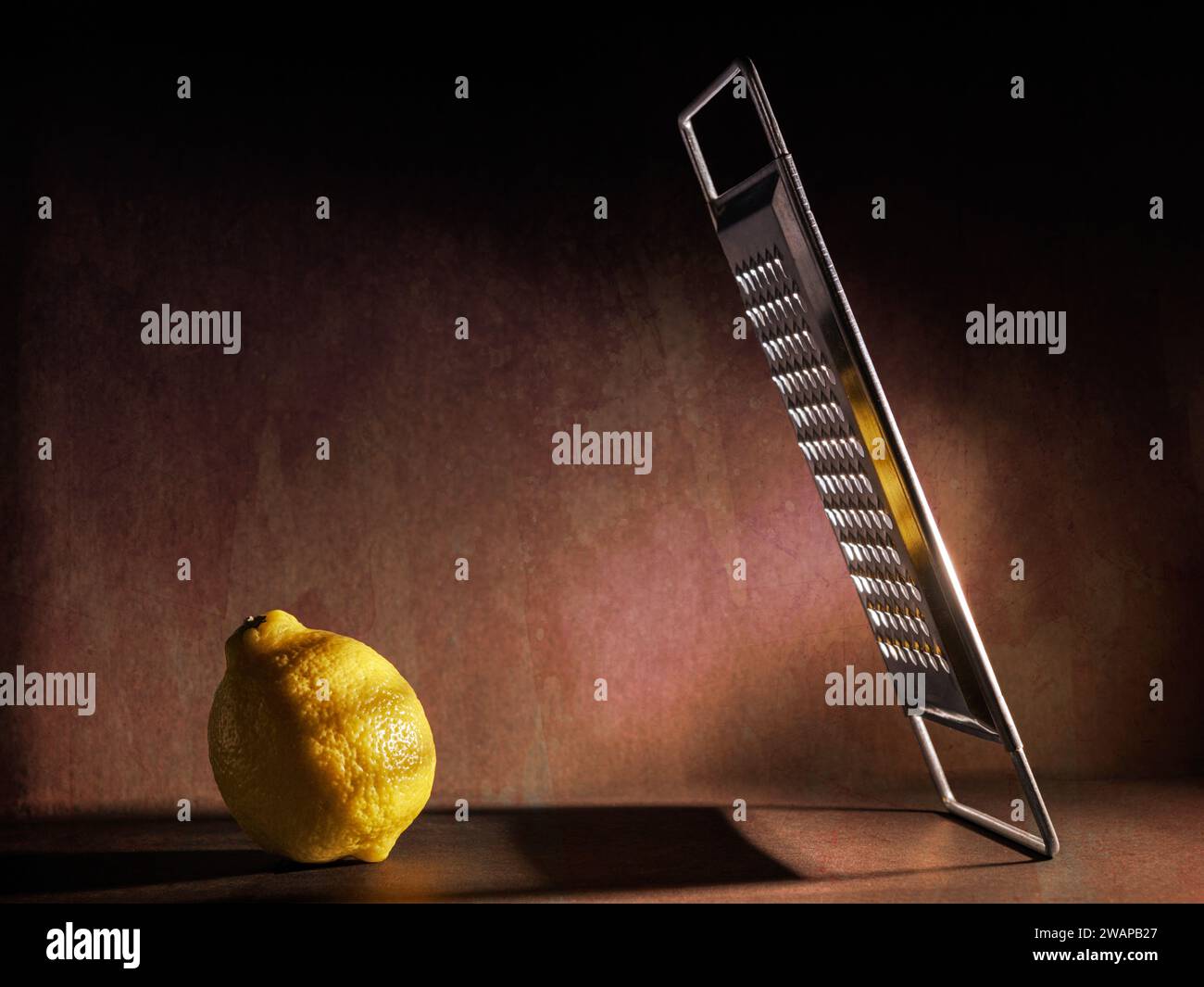 Still life with a lemon and a grater as a metaphor of life Stock Photo