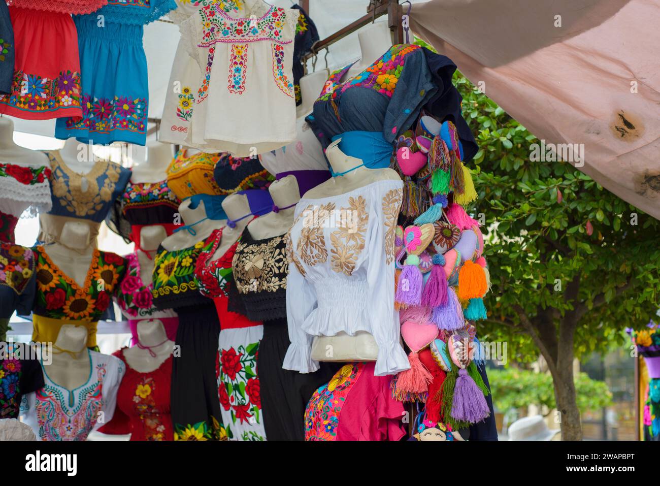 Traditional Mexican clothing with handmade embroidery. Stall in a