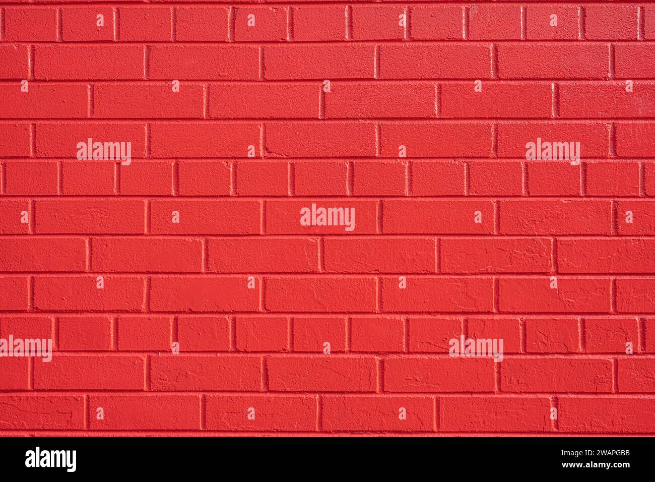 Background from a wall made of red painted bricks Stock Photo