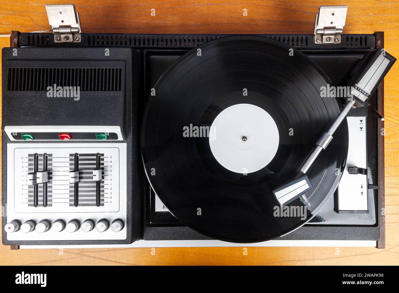 Vintage turntable vinyl record player with black vinyl on a table Stock ...