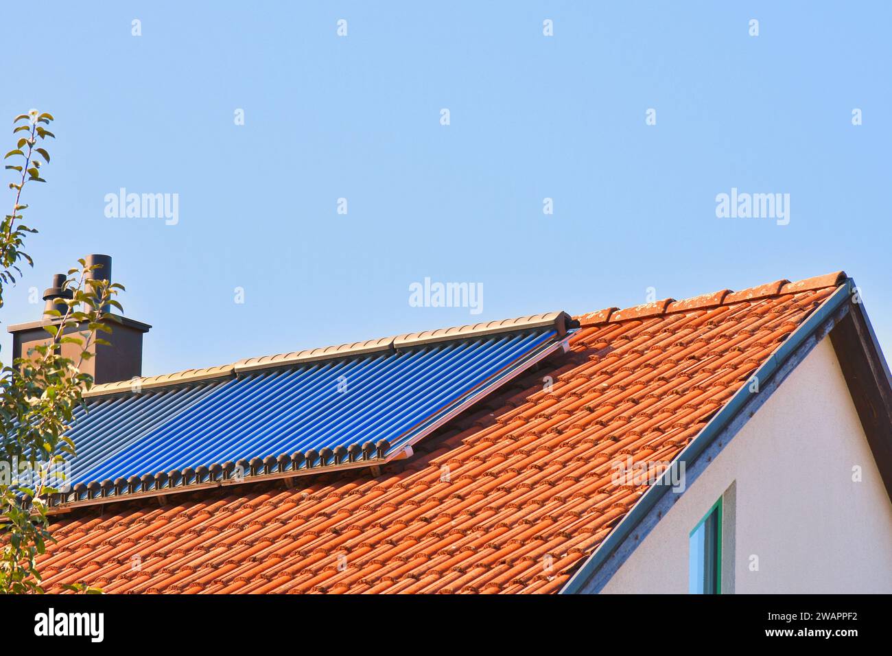 Solar thermal system on modern house roof to produce heating water ...