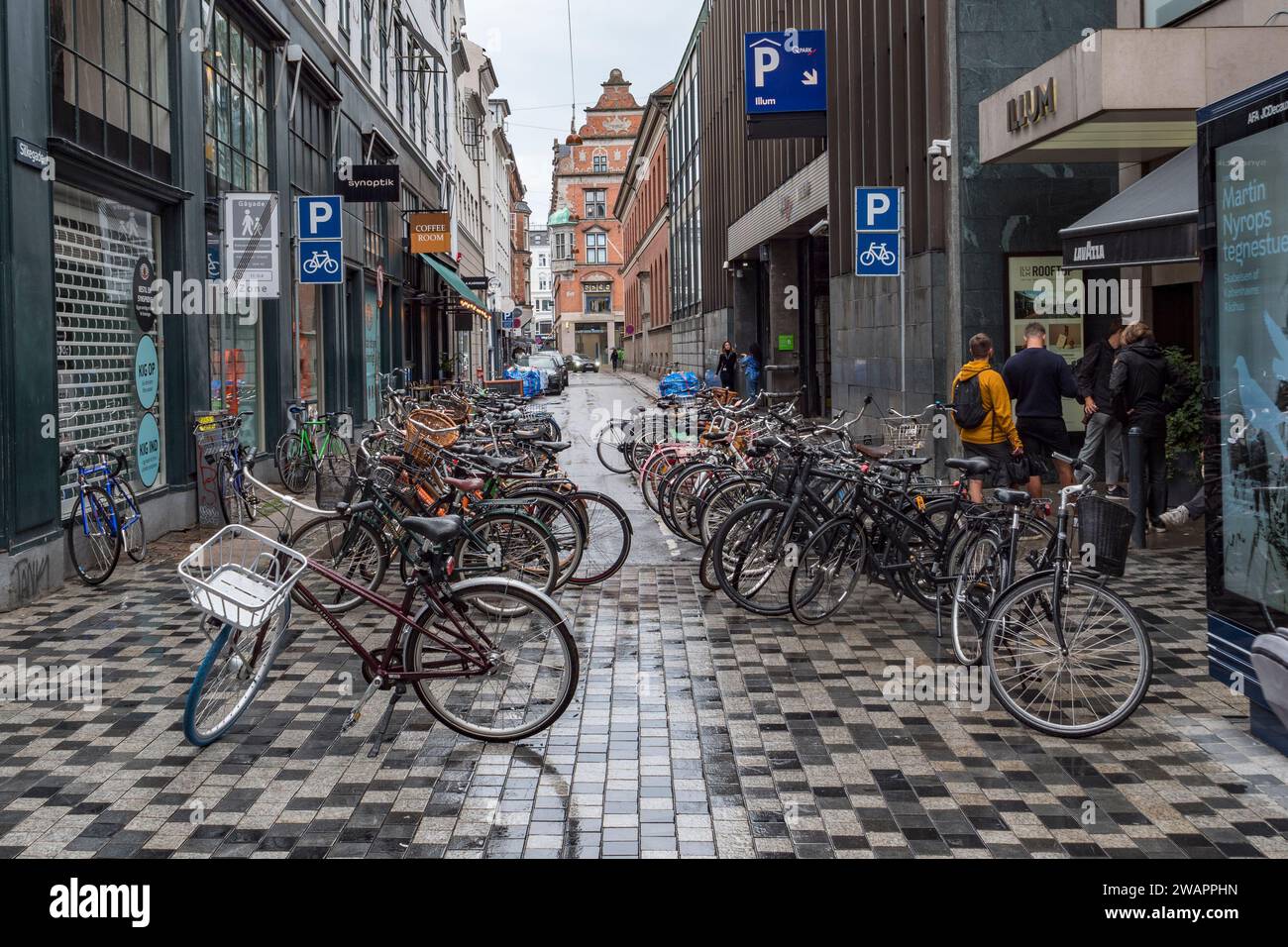 A side road bicycle parking area, a common sight in Copenhagen, Denmark. Stock Photo