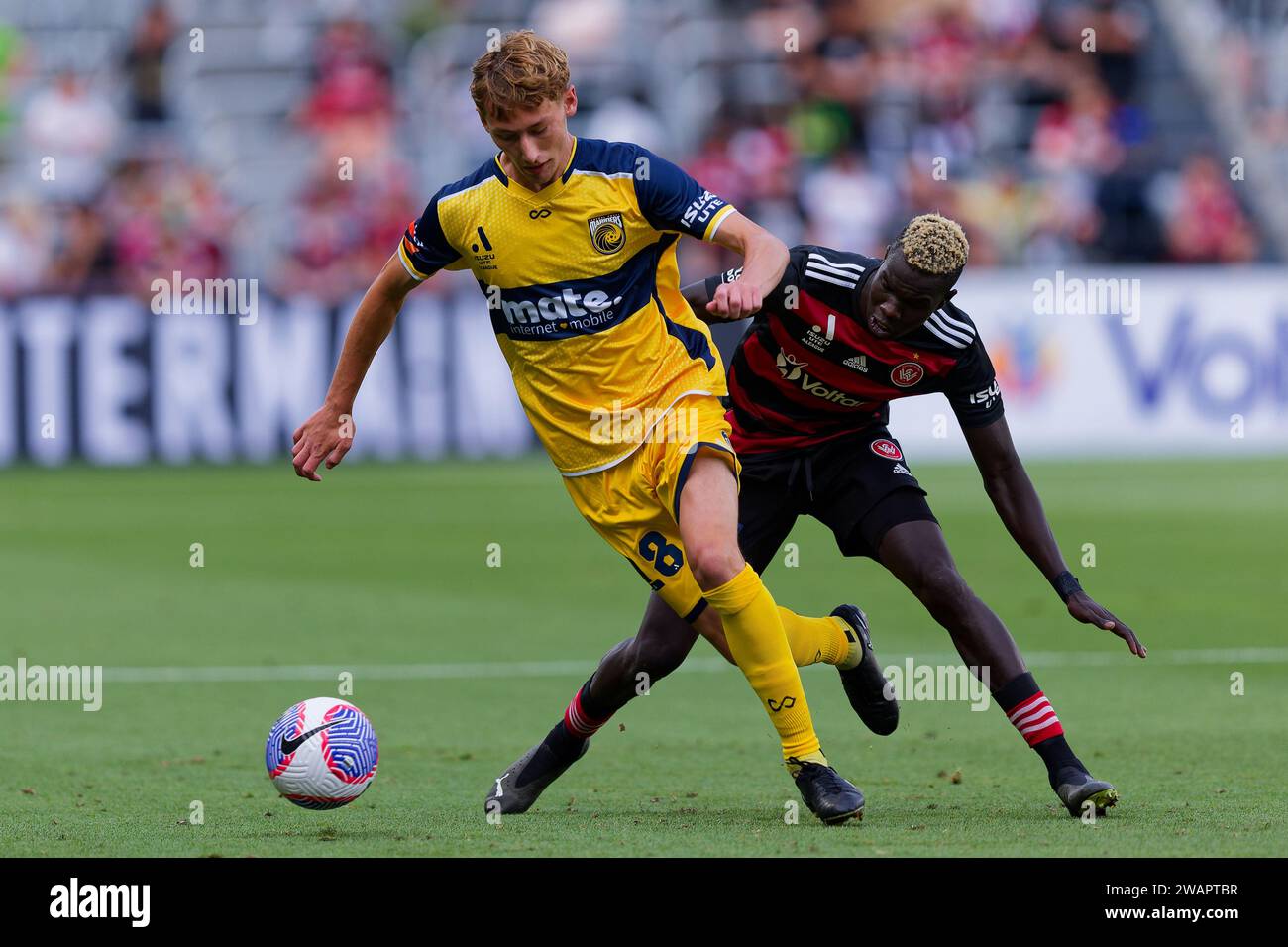 Sydney, Australia. 06th Jan, 2024. Valentino Yuel of the Wanderers competes for the ball with Jacob Farrell of the Mariners during the A-League match between the Wanderers and the Mariners at CommBank Stadium on Jan 6, 2024 in Sydney, Australia Credit: IOIO IMAGES/Alamy Live News Stock Photo