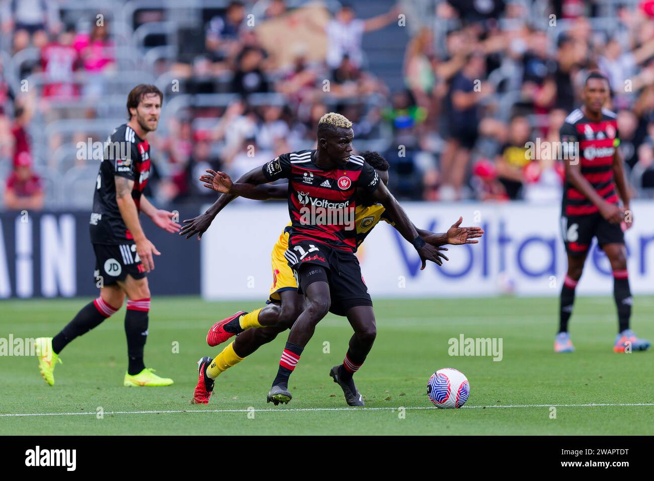 Sydney, Australia. 06th Jan, 2024. Alou Kuol of the Mariners competes for the ball with Valentino Yuel of the Wanderers during the A-League match between the Wanderers and the Mariners at CommBank Stadium on Jan 6, 2024 Credit: IOIO IMAGES/Alamy Live News Stock Photo