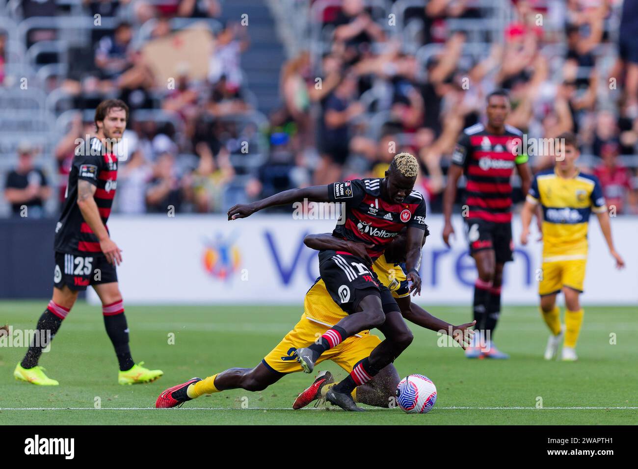 Sydney, Australia. 06th Jan, 2024. Alou Kuol of the Mariners competes for the ball with Valentino Yuel of the Wanderers during the A-League match between the Wanderers and the Mariners at CommBank Stadium on Jan 6, 2024 Credit: IOIO IMAGES/Alamy Live News Stock Photo