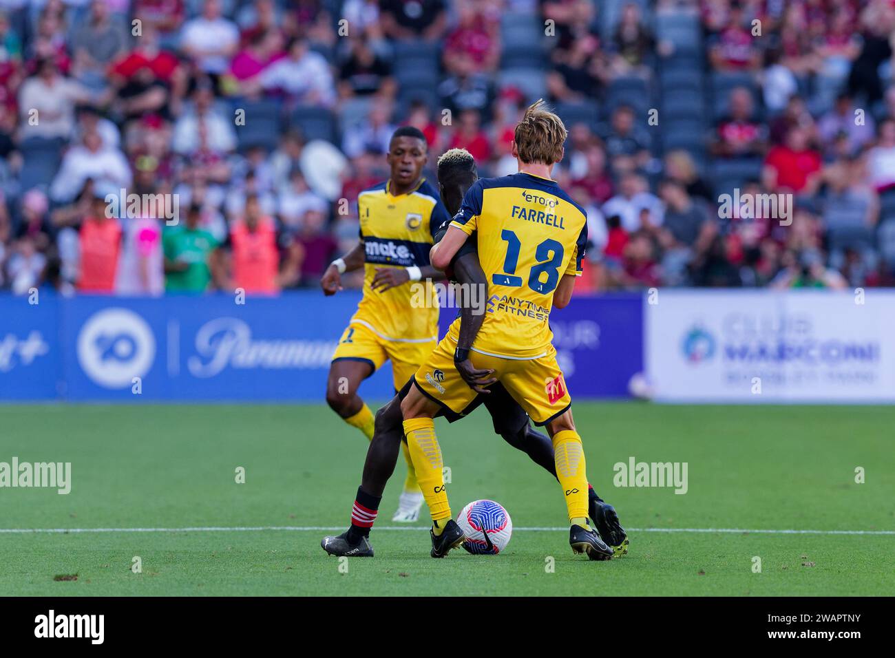 Sydney, Australia. 06th Jan, 2024. Jacob Farrell of the Mariners competes for the ball with Valentino Yuel of the Wanderers during the A-League match between the Wanderers and the Mariners at CommBank Stadium on Jan 6, 2024 Credit: IOIO IMAGES/Alamy Live News Stock Photo