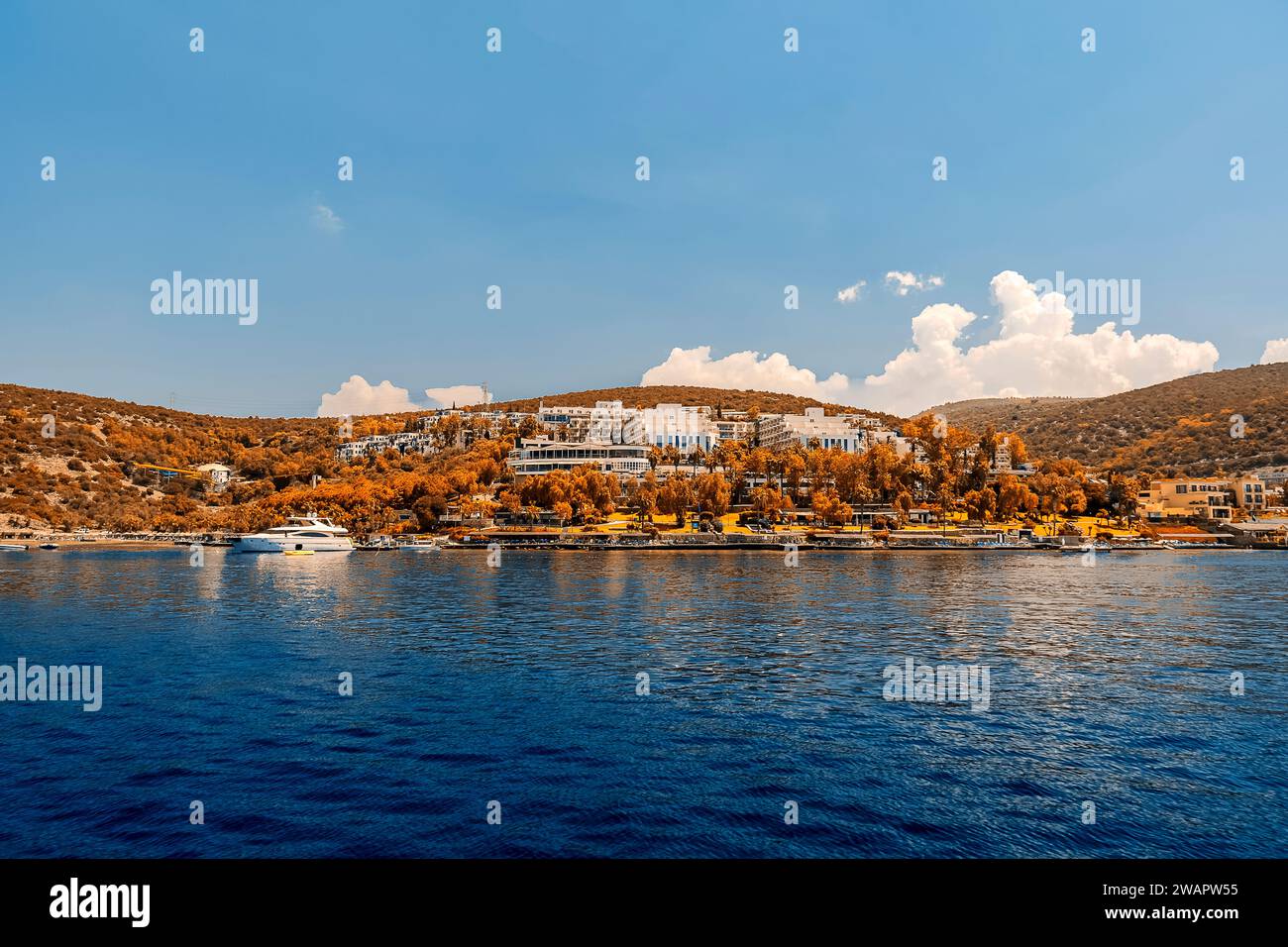 the coast of bodrum in autumn seen from the sea. In the center a resort a few steps from the beach Stock Photo
