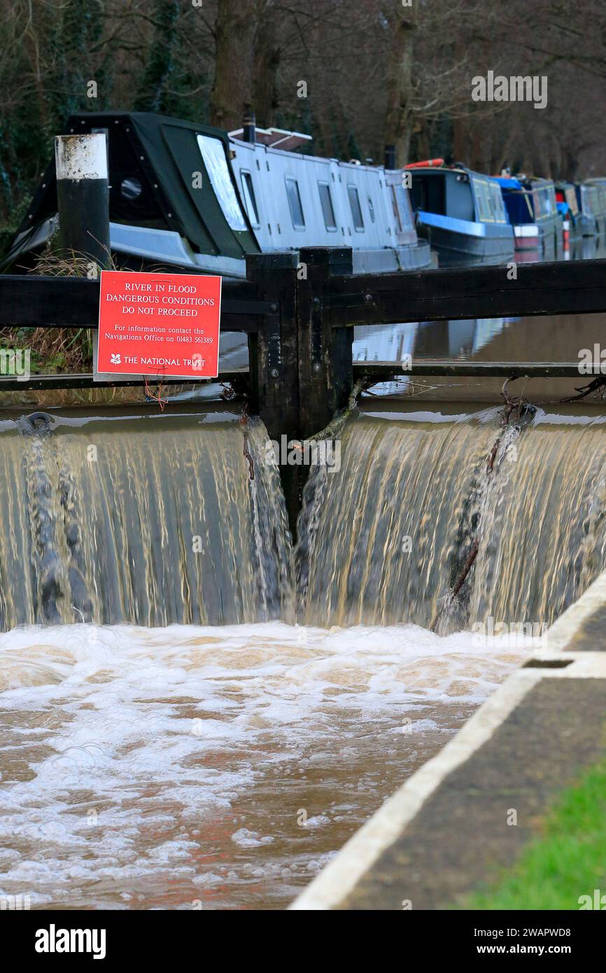 Catteshall Lane, Godalming. 06th January 2024. Rainfall from Storm Henk made its way through the river network over the last 24 hours leading to the River Wey bursting its banks at several points. Flooding at Catteshall Lock in Godalming in Surrey was one of the worst affected areas. Credit: james jagger/Alamy Live News Stock Photo