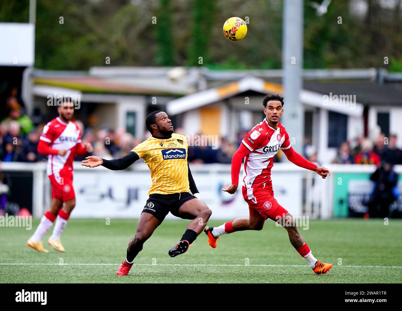 Stevenage's Terence Vancooten (right) and Maidstone United's Chi Ezennolim battle for the ball during the Emirates FA Cup Third Round match at the Gallagher Stadium, Maidstone. Picture date: Saturday January 6, 2024. Stock Photo